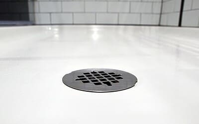 A shower that drains slowly: causes and when the problem lies in the pipework